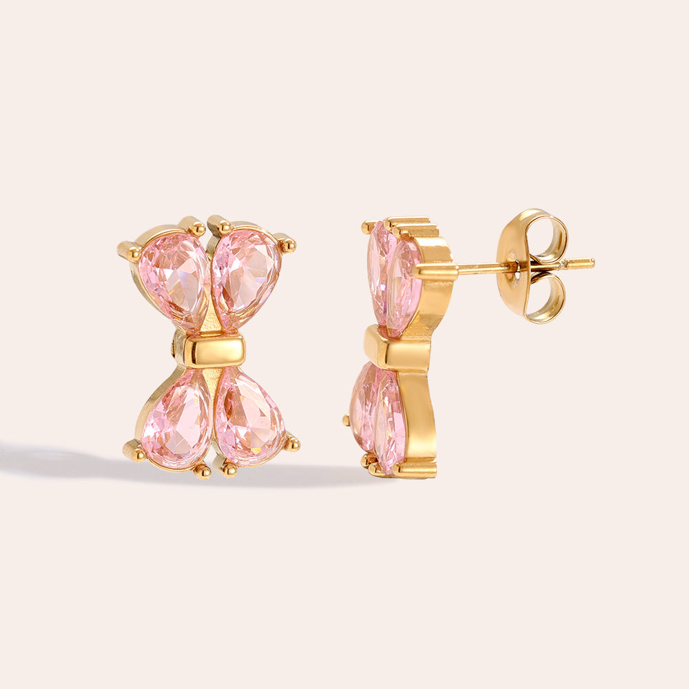 Puces Nœud Papillon Zirconia Rose Doré – fond rosé