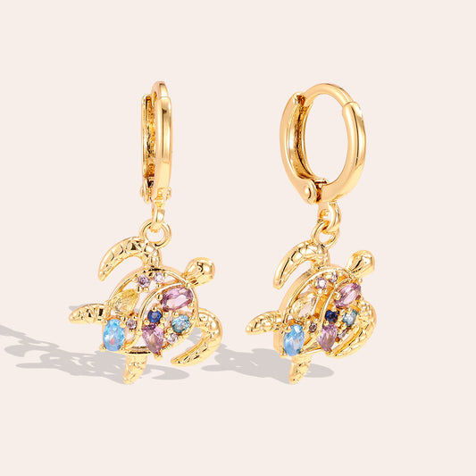 Créoles Charm Tortue de Mer Zirconia – fond rosé