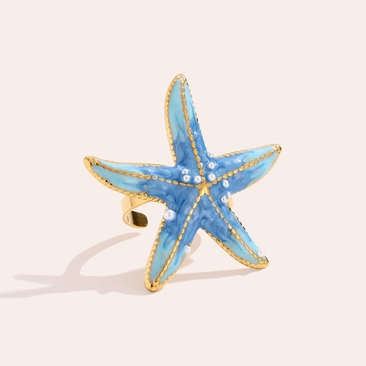 Bague Étoile de Mer Bleue Azur Nacré Liseré Doré Perles – fond beige vue complète
